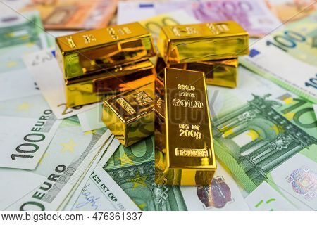 Euro Banknotes And Gold Bars. Gold Bars On Money