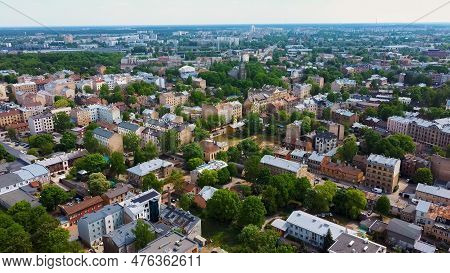 Riga Cityscape Spring Aerial Top View Video, Town, Latvia. Sunny Day Building Rooftops. Riga Skyline
