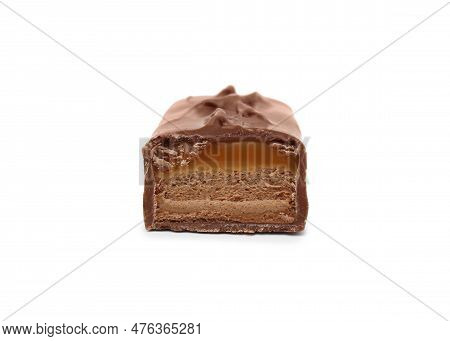 Piece Of Sweet Tasty Chocolate Bar On White Background