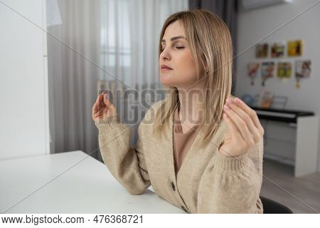 Spirituality And Young People. Girl Praying At Home Alone. Worried Woman Praying For Strenght During