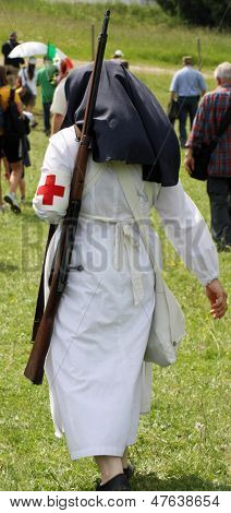 Nun Nurse Marching During A Practice Session With A Big Gun On Shoulders