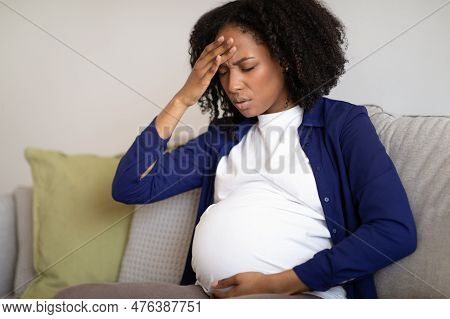 Unhappy Millennial African American Pregnant Lady With Big Belly Suffer From Headache And Health Pro