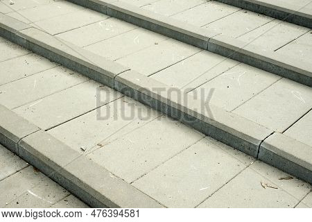 Grey Tiles For The Steps, With A Bardur Stone.. Gray Background And A Place For The Inscription.