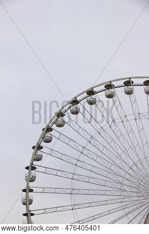 Close-up Of A Giant Wheel Of An Amusement Park On A Cloudy Day. Ideal If You Are A Lover Of Adrenali