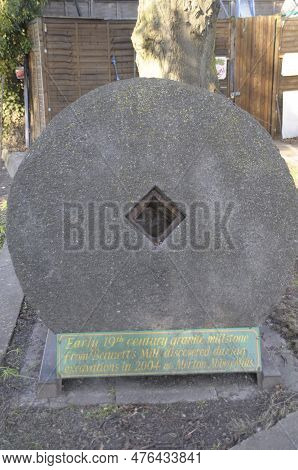 Early 19th Century Granite Millstone Fon Display In Merton Abbey Mills, London Uk.