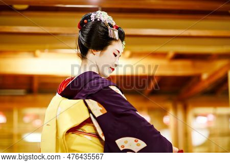 Kyoto, Japan - 18 May, 2015: Maiko Apprentice Showing Japanese Traditional Dance. Maiko Is An Appren