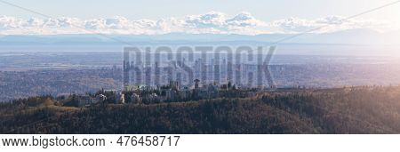 Burnaby Mountain With Cityscape In Background. Vancouver, Bc, Canada. Aerial View From Airplane.