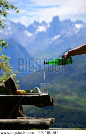 Pouring From High Height Of Natural Asturian Cider Made From fermented Apples, Asturian Cabrales Cow