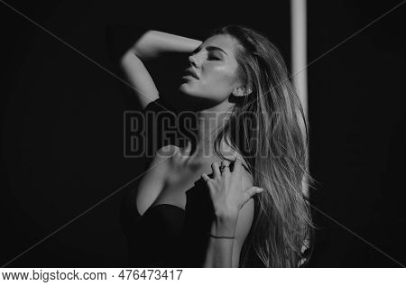 Portrait Of Beautiful Woman Model Looking Seductive And Sensual. Beauty Face With Dramatic Studio Li