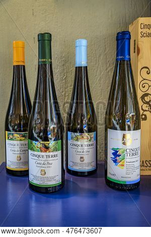 Manarola, Italy - June 1, 2022: Selection Of Bottles Of Traditional Cinque Terre Wines For Sale On D