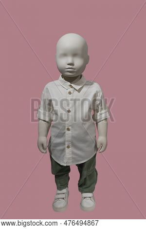 Full Length Image Of A Child Display Mannequin Wearing White Rolled-up Sleeves Shirt And Green Pants