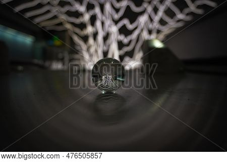 Close Up Of A Small Crystal Ball On The Floor At A Subway Station