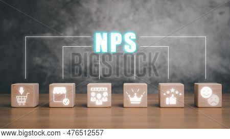 Nps, Net Promotor Score Concept, Wooden Block On Desk With Net Promotor Score Icon On Virtual Screen