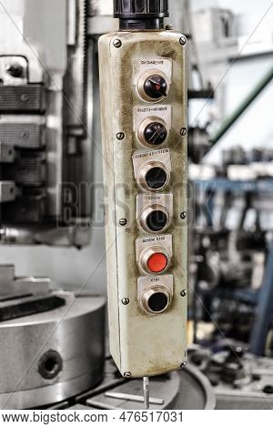 A Worker Is Operating Remote Swtich To Control Overhead Crane At The Factory Warehouse. Industrial W