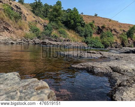 Stock Photo Of A Beautiful Natural Water Pond Near Paleshwar Waterfall, Adorned With Calm And Clean 