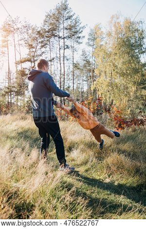 Happy Fathers Day. Dad And Son On A Walk In The Forest In Sunny Weather. Family Leisure. The Father 