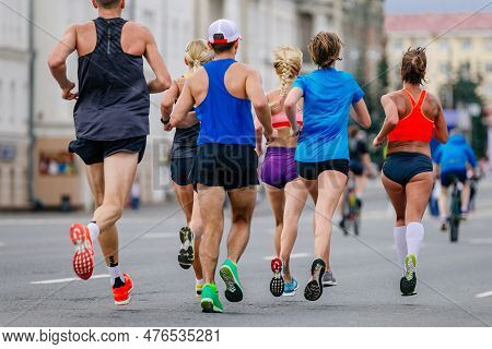 Mixed Group Runners Athletes Running Marathon In City, Male And Female Joggers Summer Sports Race