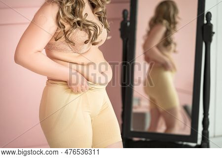 Fat Woman In Corrective Panties In The Fitting Room, Flabby Belly And Hips After Pregnancy, Overweig