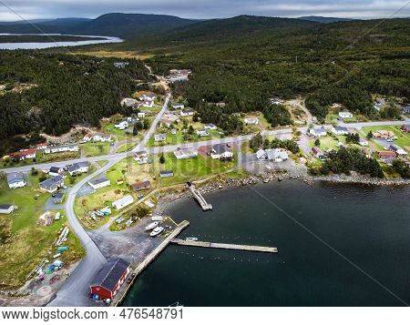 Aerial Small East Coast Village Of Whiteway Newfoundland Overlooking Boat Docks And Breakwater With 