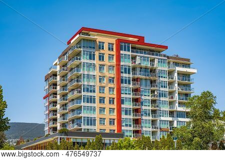 Facade Of New Residential Townhouses. Apartment Buildings In Canada. Modern Complex Of Apartment Bui
