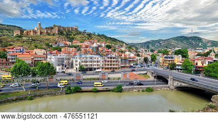 Panorama Of The Old Town Of The Capital Of Georgia, The City Of Tbilisi In Summer Sunny Day. Kura Ri