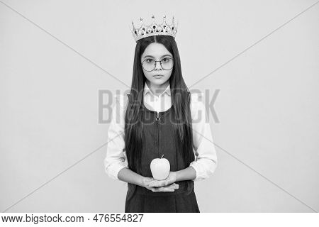 Teen Child In Queen Crown Hold Apple Isolated On Yellow Background. Princess Girl In Tiara. Teenage 