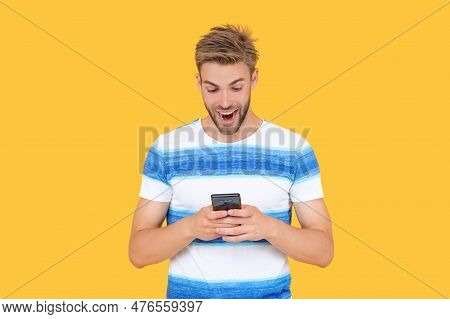 Amazed Man Uses Phone To Make Effective Communication. Man Has Phone Communication. Digital Communic