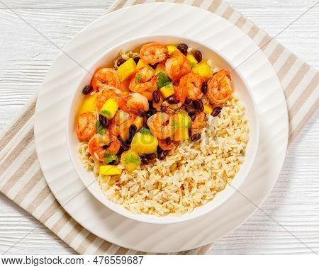 Caribbean Grilled Shrimps With Black Beans, Mango Pineapple Salsa Served With Brown Rice In White Bo