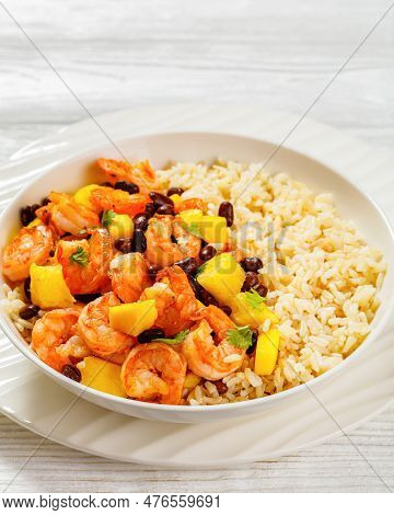 Close-up Of Caribbean Grilled Shrimps With Black Beans, Mango Pineapple Salsa Served With Brown Rice