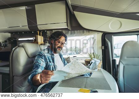 Happy Travel Man Enjoying Vacation And Road Trip Map Adventure Smiling Inside A Camper Van Choosing 