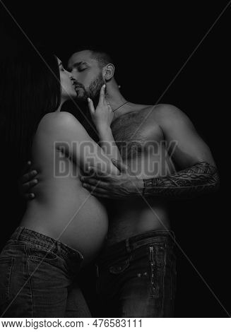 A Tender Kiss. Sensual Couple In Love. Family Couple Expacting A Baby. Married Couple Of Pregnant Yo