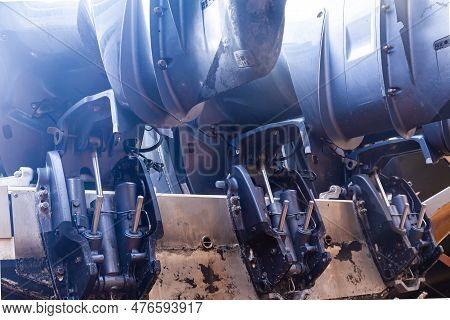 Lifting Mechanisms On Outboard Motors At The Stern Of The Boat. Transom Lift On Outboard Motors Of A