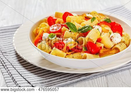 Roasted Pepper Tomato Mozzarella Pasta Salad In White Bowl On White Wood Table, Horizontal View, Clo