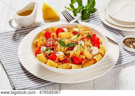 Roasted Pepper Tomato Mozzarella Pasta Salad In White Bowl On White Wood Table With Fork And Olive O