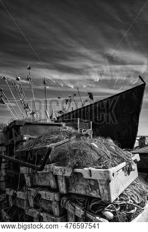Chlopy, West Pomeranian - Poland - 2023: Fishing Port - Fish Boxes And Fishing Nets On The Backgroun