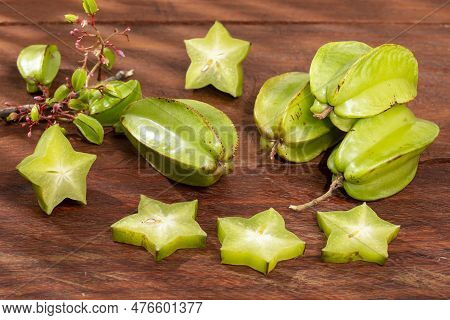 Star Fruit Or Carambola Green - Averrhoa Carambola; Photo On Wooden Background