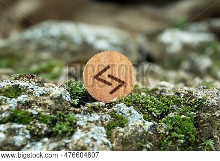 Wooden Rune Jera On Stone With Moss Outdoors, Closeup