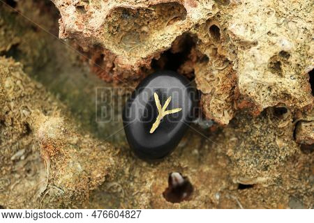 Black Rune Algiz On Stone Outdoors, Closeup