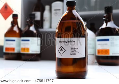 Isopropyl Nitrite In Glass, Hazardous Chemicals And Flammable Symbols On Containers In Industry Or L