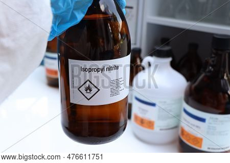 Isopropyl Nitrite In Glass, Hazardous Chemicals And Flammable Symbols On Containers In Industry Or L