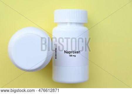 Naproxen Pill In White Bottle, Pill Stock, Medical Or Pharmacy Concept