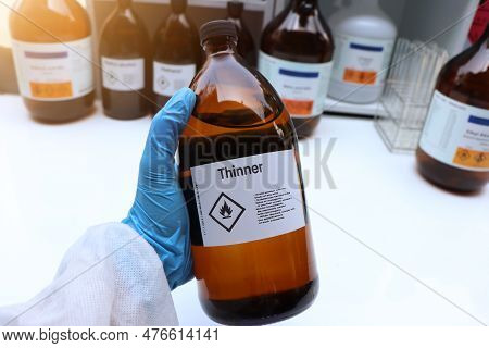Thinner In Glass,hazardous Chemicals And Symbols On Containers In Industry Or Laboratory