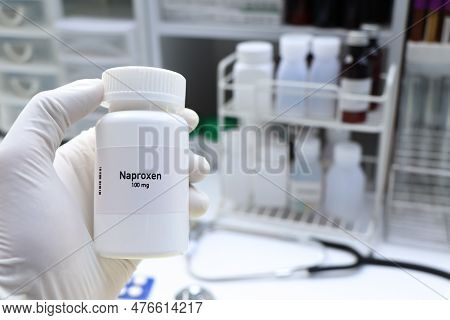 Naproxen Pill In White Bottle, Pill Stock, Medical Or Pharmacy Concept
