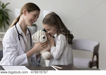 Little Girl Play Otolaryngologist During Her Visit In Clinic