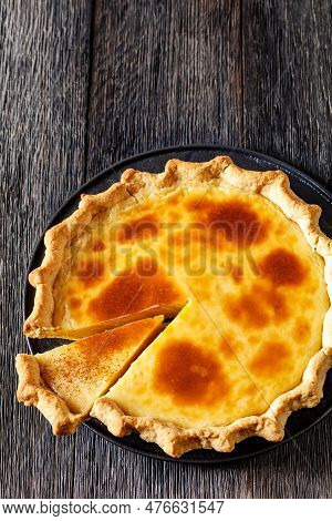 Classic Sugar Cream Pie, Hoosier Pie, Indiana Custard Cream Pie On Black Plate On Dark Wood Table, A