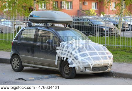 The Minicar After The Accident Is Taped And Parked Near The Side Of The Road, Kollontai Street, St. 