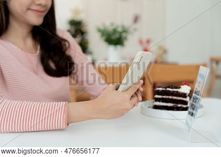 Woman Use Smartphone To Scan Qr Code For Order Menu In Cafe Restaurant With A Digital Delivery. Choo