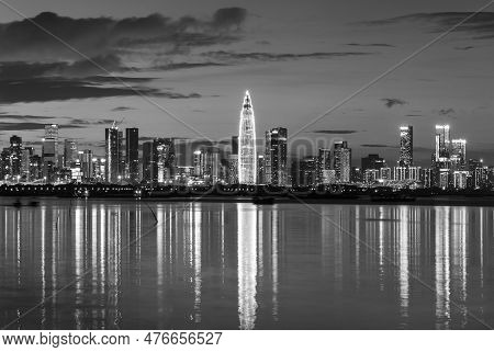 Skyline Of Shenzhen City, China At Dusk. Viewed From Hong Kong Border Lau Fau Shan