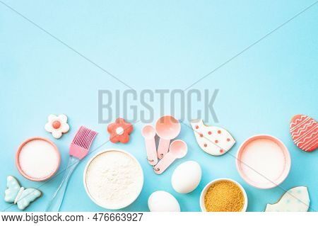 Easter Baking, Flour, Edds, Sugar And Gingerbread Cookies. Top View On Blue.