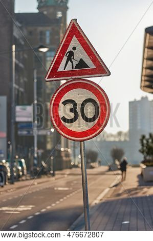 Traffic Signs On A City Street, Road Construction Ahead And Speed Limit